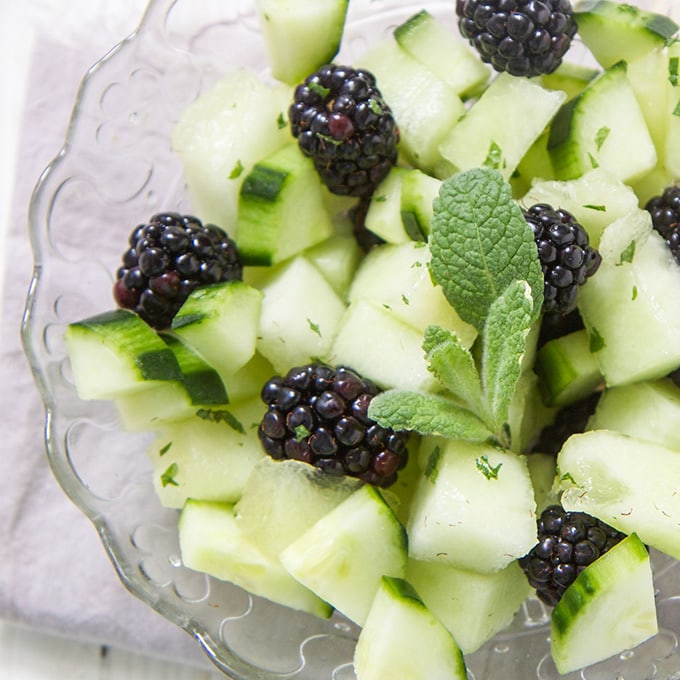 A bowl of blackberry and cucumber finger salad for baby led weaning, toddlers, and kids.