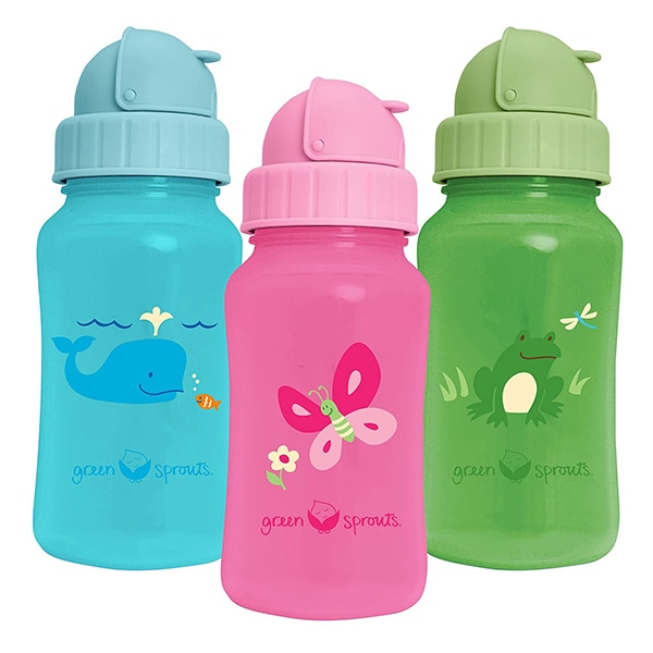 3瓶，蓝色，粉红色和绿色，彼此相邻。